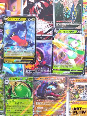 many different types of pokemon cards displayed on a table