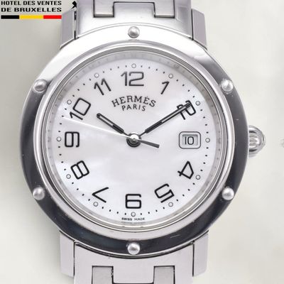 a close up of a wrist watch with a white dial