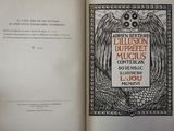an open book with a picture of an owl on it