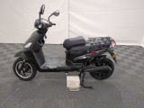 an image of a scooter parked on a checkered floor