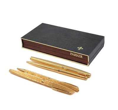 a close up of a pen and a box on a white background