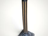 an image of a black and gold pedestal with a wooden top