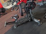 a gym with a lot of machines in the room