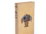 a book with a picture of a vase of flowers on it