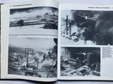 an open book with pictures of a city and a plane