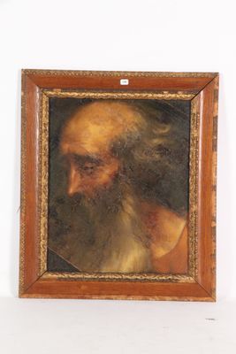 un vieux tableau représentant un homme à la longue barbe, dans un cadre en bois