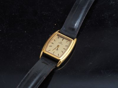 a watch that is sitting on a black surface