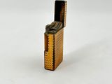 a lighter that is sitting on a white surface