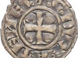 Gros plan sur une pièce de monnaie portant une croix