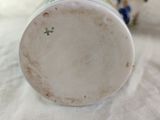 a close up of a vase on a table