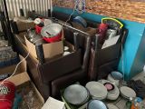 a room with a lot of boxes and containers on the floor
