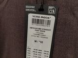 a close up of a person ' s shirt with a tag attached to it