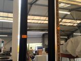 a large mirror in the middle of a room with a lot of boxes