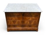 an old wooden chest with marble top