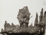 a black and white photo of a castle made out of dirt