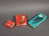 two boxes of cigarettes are sitting next to each other on a table