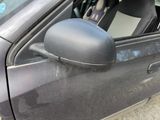 a car that has a seat in the passenger side mirror