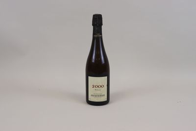 a bottle of wine that is sitting on a table