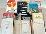 many books that are sitting on top of a table