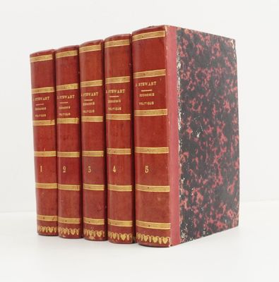 trois livres rouges superposés sur une surface blanche