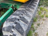 a tractor that is parked on the side of the road