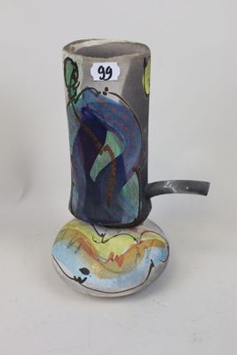 a cup with a handle that has a painting on it