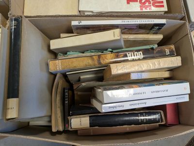 a box full of books sitting on top of a table