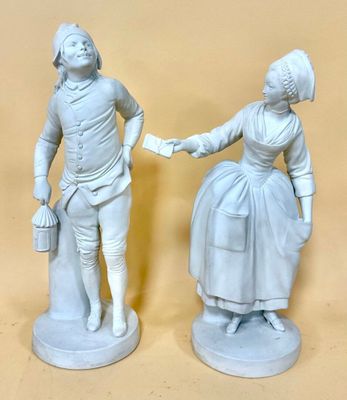two statues of a man and a woman shaking hands in front of a beige background
