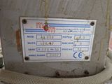 a label on the back of a machine that is sitting on a table