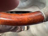 a close up of a person holding a steering wheel