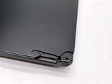 a close up of a laptop on a white surface