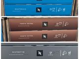 several boxes of different types of coffee are stacked on top of each other