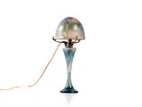 a lamp that is sitting on a table with a cord attached to it