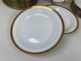 a lot of plates that are sitting on a table