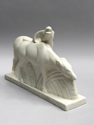 a white sculpture of a horse and a bird on top of it