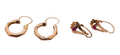 three pairs of gold hoop earrings on a white background