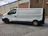 a white van that is parked in the parking lot
