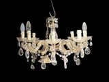 a close up of a chandelier hanging from a ceiling