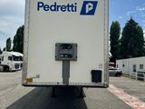 the back end of a delivery truck parked in a parking lot