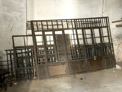 a room that has a bunch of old windows in it