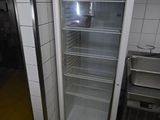 an image of a refrigerator in a kitchen with a dirty floor