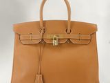 a brown leather handbag on a white background