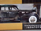 a model of a black car in a display case