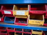 many bins of assorted items on a shelf