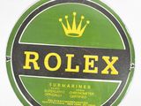 a green and black sign with a crown on it