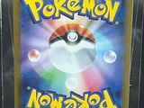 a picture of a pokemon card on display in a case