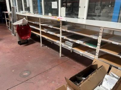many shelves in the room with boxes and boxes on them