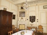 a dining room with a table and chairs and a chandelier