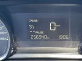 the dashboard of a car with a digital clock on it ' s display