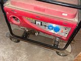 a portable generator sitting on a cart in a garage